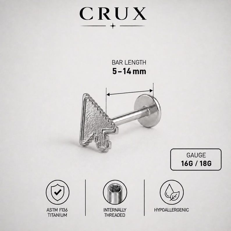 May include: A silver-colored titanium labret stud featuring a computer mouse cursor arrow design. The jewelry has a bar length of 5-14 mm and a gauge of 16G or 18G. It is internally threaded, hypoallergenic, and labeled with the brand name CRUX.