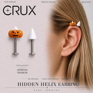 May include: Two helix stud earrings with silver-tone posts. One stud features an orange pumpkin with a white triangular top and black facial features. The other stud is a plain white cone. The text reads CRUX JEWELRY, HIDDEN HELIX EARRING.