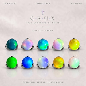 May include: Ten spherical opal piercing jewelry attachments arranged in two rows. Each piece features a smooth, iridescent opal stone set in a metallic base, labeled as ASTM F136 titanium. The text reads CRUX JEWELRY, PIERCING JEWELRY, OPAL ACCESSORIES SERIES, and COMPATIBLE WITH ALL PIERCING BARS.