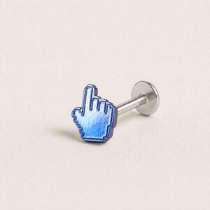 May include: A body jewelry stud featuring a metallic blue cursor hand icon as the decorative top. The piece includes a straight silver-toned post and a flat circular backing, designed for secure placement in a piercing with a clean finish.