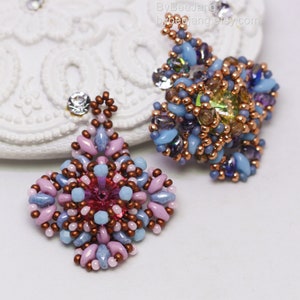 May include: A pair of beaded earrings with a floral design. The earrings are made with a variety of colors, including pink, blue, and brown. The earrings are hanging from a white surface.