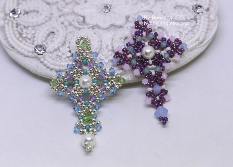 Chrisia pendants in two colors. One is in silver, green peridot and light blue. The other is in purple, blue, pink and pacific opal.