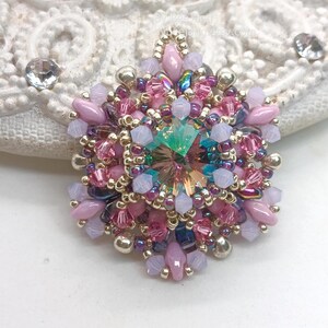 Ceres pendant in pink, purple and silver.
