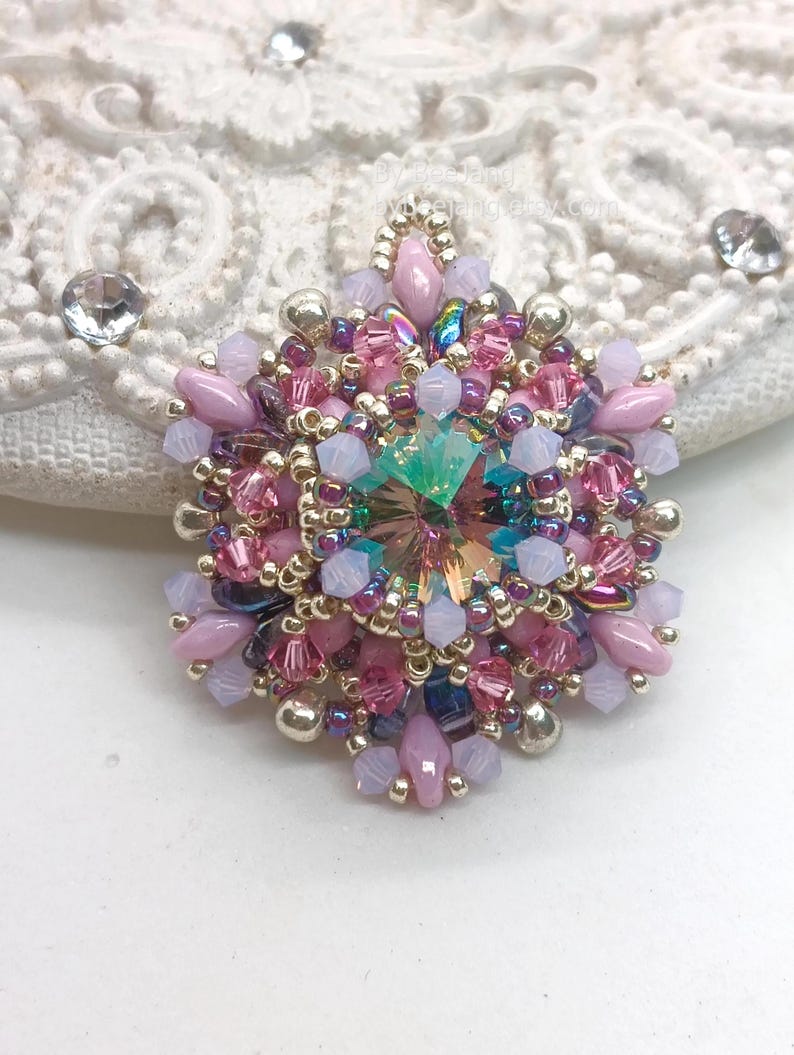 Ceres pendant in pink, purple and silver.