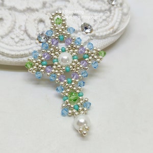 Chrisia pendants in silver, green peridot and light blue.