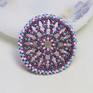 Olwyn wheel pendant in purple, pink and blue.