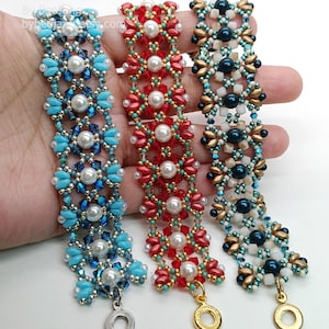 May include: Three beaded bracelets in blue, red, and teal. Each bracelet features a floral design with pearl accents and a metal clasp. The bracelets are handmade and suitable for everyday wear.