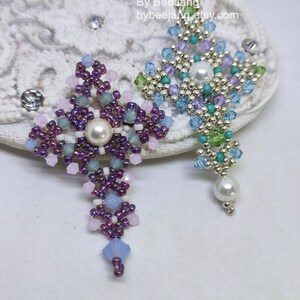 Chrisia pendants in two colors. One is in silver, green peridot and light blue. The other is in purple, blue, pink and pacific opal.