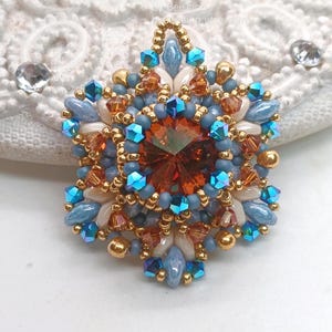 Ceres pendant in copper, blue and beige.