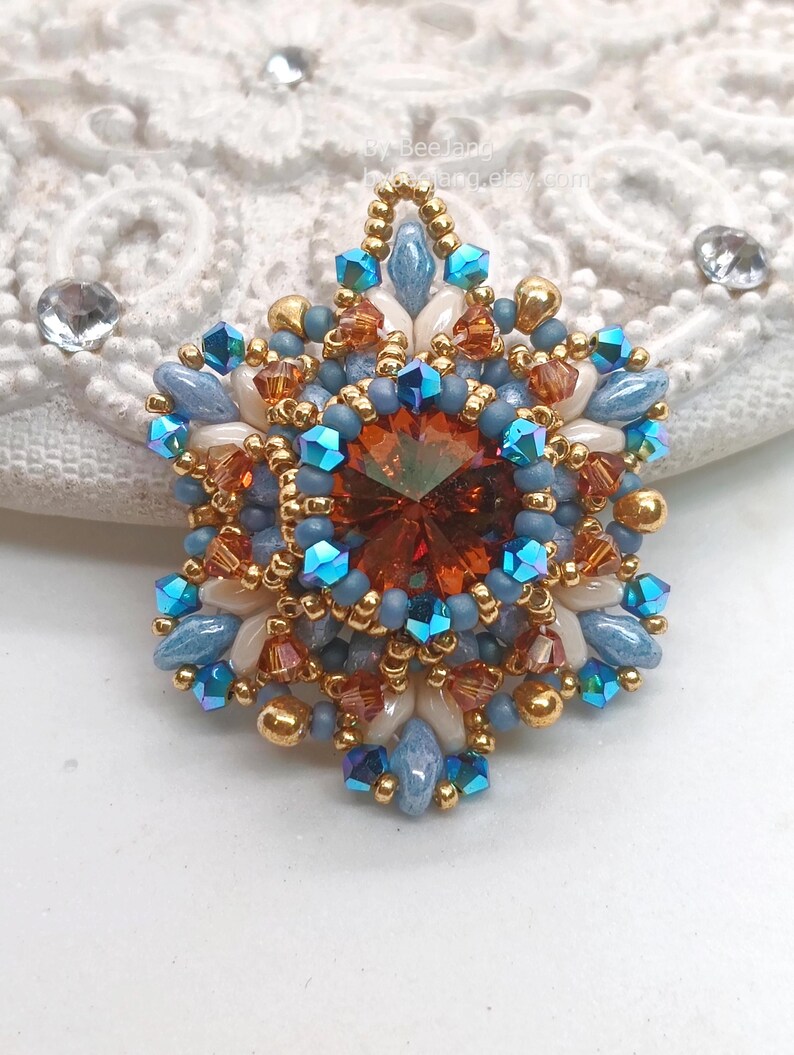 Ceres pendant in copper, blue and beige.