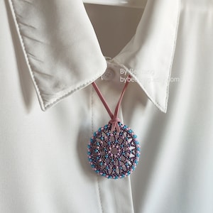 Olwyn wheel pendant in purple, pink and blue.
