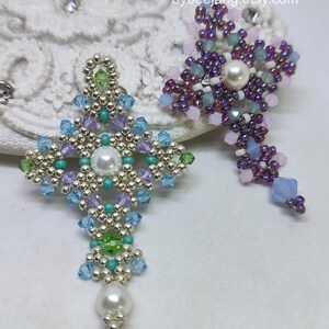 Chrisia pendants in two colors. One is in silver, green peridot and light blue. The other is in purple, blue, pink and pacific opal.