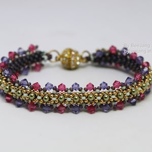 May include: A multi-coloured beaded bracelet with a magnetic clasp. The bracelet features a pattern of gold, green, white, purple and pink beads.