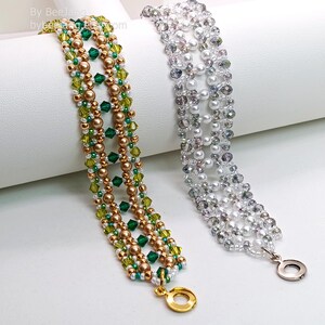 Two wide, handcrafted beaded cuff bracelets are draped over a white stand, showcasing an intricate Right Angle Weave lattice design. Each piece is woven with faceted bicone crystals, smooth round pearls, and seed beads, secured with a metallic toggle clasp.

    Left: Emerald and olive green crystals with gold-toned pearls and a gold clasp.
    Right: Clear crystals with white pearls and a silver clasp.