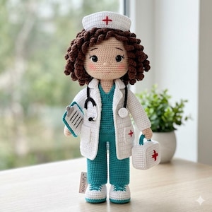 May include: Crocheted doll dressed as a nurse, wearing a white coat, teal scrubs, and a white hat with a red cross. The doll has brown curly hair, a stethoscope, and a small medical bag. The doll is holding a clipboard.