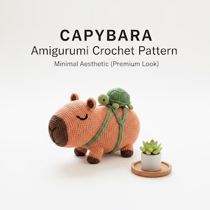 May include: A peach-coloured crochet capybara amigurumi with a green turtle on its back. The capybara has a brown snout and feet. The text "CAPYBARA Amigurumi Crochet Pattern" is displayed at the top of the image.
