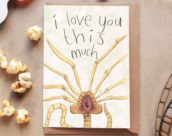 May include: A greeting card with a watercolor illustration of a creature with multiple legs and the text "i love you this much".