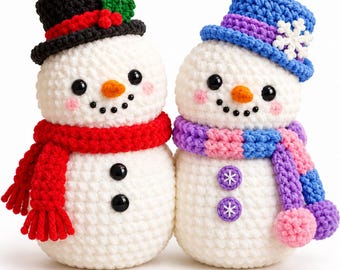 May include: Two white crocheted snowmen figures. The left snowman wears a black top hat with red ribbon and green holly, a red scarf, and two black buttons. The right snowman wears a blue hat with a white snowflake, a purple and pink scarf, and two purple snowflake buttons.