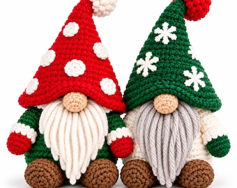 May include: Two handmade crochet gnomes with pointed hats. The left gnome has a red hat with white polka dots and a white beard. The right gnome has a green hat with white snowflake appliques and a grey beard. Both have brown feet and round noses.