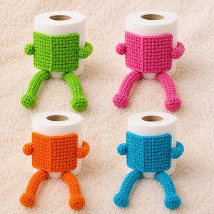 May include: Four white toilet paper rolls, each adorned with a crocheted cover featuring a square front panel, two arms, and two legs. The covers come in bright green, hot pink, orange, and blue, with each piece wrapped around the center of the roll.
