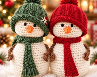 May include: Two crocheted snowman figures made of white yarn with orange carrot-shaped noses and black bead eyes. One snowman wears a green ribbed hat with a pom-pom and a matching scarf, while the other wears a red ribbed hat and scarf.