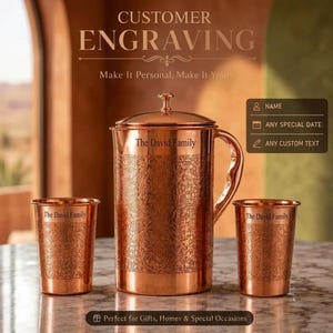 May include: A copper pitcher and two matching tumblers, each featuring an intricate floral pattern and the engraved text "The David Family". The pitcher has a lid and a curved handle. Text on the image includes "CUSTOMER ENGRAVING" and "NAME", "ANY SPECIAL DATE", "ANY CUSTOM TEXT".
