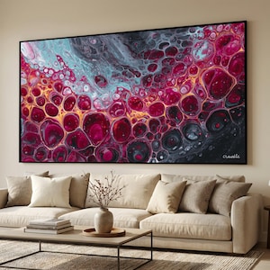 May include: Abstract art print in a black frame. The artwork displays a vibrant mix of colours, including deep reds, blues, and gold, creating a bubble-like pattern. The word "create" is written in the bottom right corner.