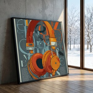 May include: Framed art print featuring a stylized illustration of orange headphones against a gray background with abstract letterforms. The artwork is displayed on a wooden floor next to a window with a snowy outdoor view.