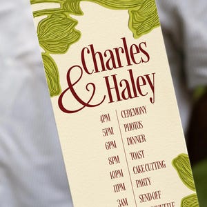 May include: A wedding itinerary card with the names "Charles & Haley" in burgundy script. The card lists the ceremony schedule, including times for the ceremony, photos, dinner, toast, cake cutting, party, send off, and last shuttle. Green floral design.