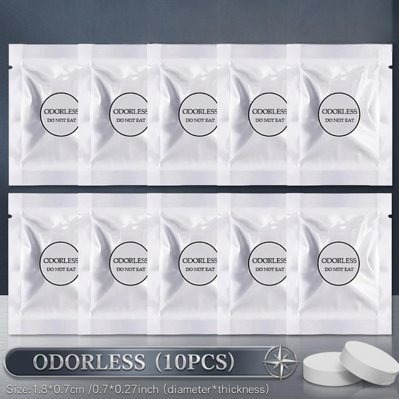 May include: Ten white, sealed packets with the word "ODORLESS" and "DO NOT EAT" printed on them. The packets are arranged in two rows of five. Below, the text "ODORLESS (10PCS)" is displayed. Two white tablets are visible at the bottom right.