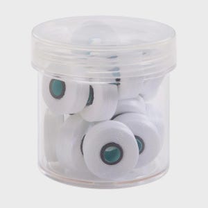 May include: A transparent plastic jar containing numerous white thread spools. Each spool features a teal centre and is tightly wound. The jar has a clear lid and rests on a light grey surface.