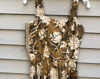 Vintage 1950s Madmen style full circle Sun dress with brown tone floral print.