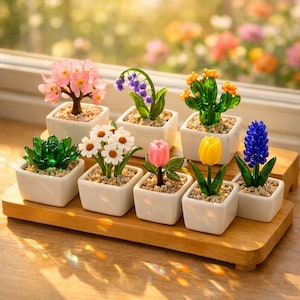 May include: A set of three ceramic mugs with a speckled, matte finish. The mugs are in shades of cream, light gray, and dark gray. Each mug has a simple, minimalist design and a rounded handle.