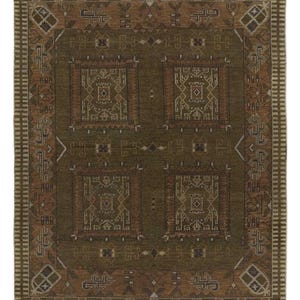 May include: A rectangular, olive green rug with a detailed geometric pattern. The rug features a central design of four squares with intricate, symmetrical motifs in shades of brown and cream, framed by a border with repeating geometric shapes.