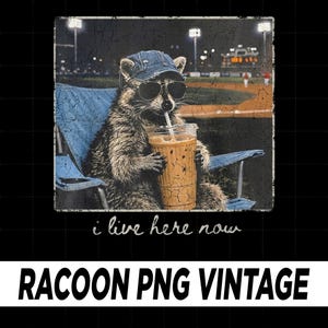 May include: Vintage graphic of a raccoon wearing sunglasses and a denim cap, sitting in a blue folding chair, and drinking from a clear cup with a straw. The text "i live here now" is below the raccoon. The words "RACCOON PNG VINTAGE" are at the bottom.