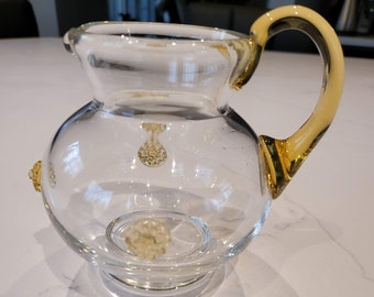 Small glass pitcher with applied glass flowers