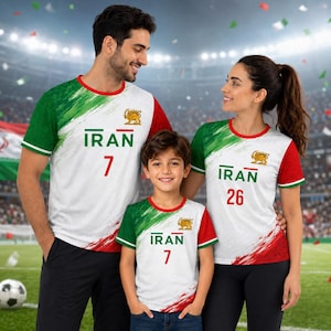May include: Three matching white t-shirts featuring green and red brushstroke accents on the sleeves and sides. Each shirt displays the text IRAN in green, a gold lion emblem, and a unique player number in red on the front chest area.