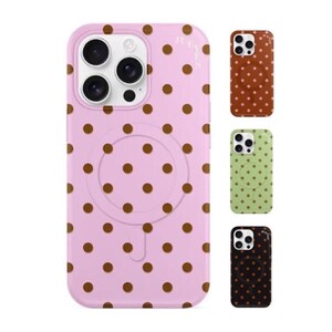 May include: A pink phone case with brown polka dots. The case has a circular cutout and is shown with three other cases in brown, green, and black, each with a polka dot pattern.