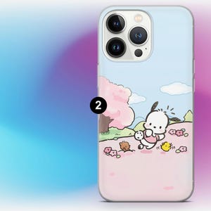 May include: A light blue phone case featuring a cartoon scene with a white dog-like character, a pink tree, and other small characters. The case has a gradient pink and blue background.
