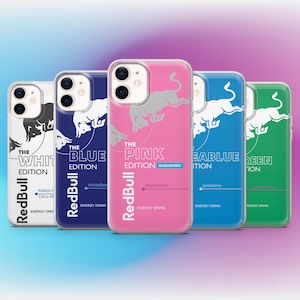 May include: Five phone cases in a row, each with a different colour: white, blue, pink, blue, and green. Each case features the Red Bull logo and the words "The Edition" with different flavour names. The pink case is labelled "Sugarfree".