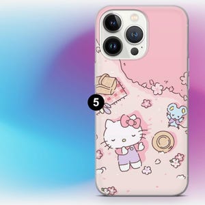 May include: Pink phone case featuring a cartoon picnic scene with Hello Kitty, a mouse, flowers, and a picnic basket. The case has a clear border and is designed for a smartphone.
