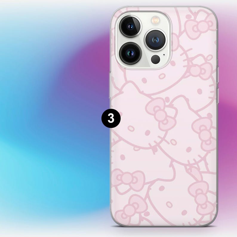 May include: A light pink phone case featuring a repeating pattern of Hello Kitty faces and bows. The case has a smooth finish and a camera cutout. The number "3" is printed in black on the case.