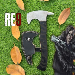 May include: A white ceramic mug with a black handle and the text "But First, Coffee" in a black, bold font. The mug is on a white surface. The mug is 4 inches tall.