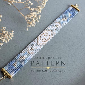 May include: A beaded loom bracelet pattern in shades of blue, white, and gold. The bracelet features a geometric design and gold-colored end caps. The text "LOOM BRACELET PATTERN PDF INSTANT DOWNLOAD" is visible.