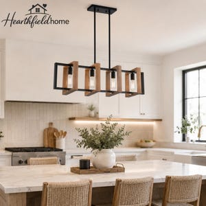 May include: A rectangular linear chandelier featuring four exposed light bulbs encased in natural wood frames with a black metal structure. The fixture is suspended by two thin black rods from a rectangular black ceiling canopy.