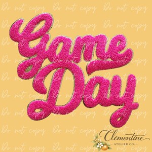 May include: A pink, fuzzy "Game Day" design on a yellow background. The text has a 3D effect and is in a playful, cursive font. The bottom right corner features the text "Clementine - Atelier Co."