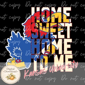 May include: A digital download design featuring the text "HOME SWEET HOME" in a bold, layered font. The design incorporates the Kansas Jayhawks mascot in blue, red, and yellow, with "Kansas University" in a script font. The background is black.