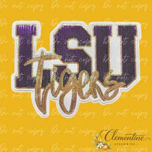 May include: A decorative patch featuring the letters LSU in purple with a white border, layered with the word Tigers in gold script. The LSU letters are filled with a purple dot pattern, while the word Tigers has a gold, reflective, holographic finish.