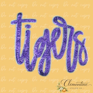 Puede incluir: Escritura "Tigers" con lentejuelas moradas sobre un fondo amarillo, delineada con lentejuelas plateadas. La esquina inferior derecha presenta el logotipo "Clementine Atelier Co." con elementos florales y frutales.