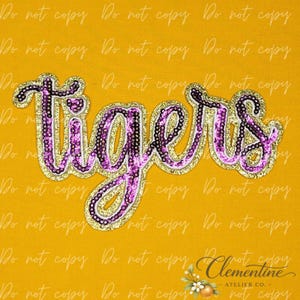 May include: A decorative patch featuring the word tigers in cursive script. The lettering is crafted from purple sequins with a gold glitter border. The design is set against a solid yellow background with a repeating watermark text overlay.